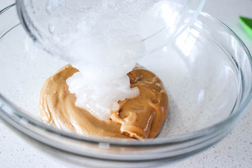 mixing coconut oil into peanut butter
